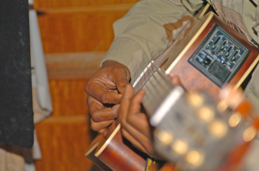 Jesse Martin, MNC - Iraq safety officer, plays guitar