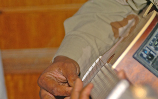 Jesse Martin, MNC - Iraq safety officer, plays guitar