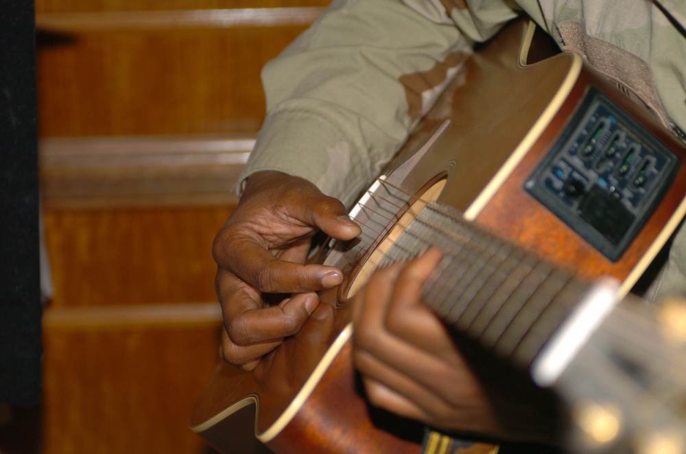 Jesse Martin, MNC - Iraq safety officer, plays guitar