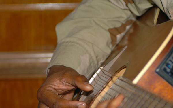 Jesse Martin, MNC - Iraq safety officer, plays guitar
