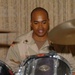 Petty Officer 1st Class Michael Music plays drums