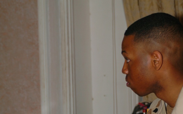 Spc. Jason Peoples accompanies the choir on piano