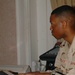 Spc. Jason Peoples accompanies the choir on piano