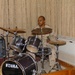 Petty Officer 1st Class Michael Music plays drums