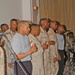 Members of the Camp Victory, Iraq, gospel choir pray