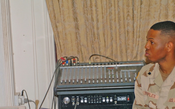 Spc. Jason Peoples accompanies the choir on the piano