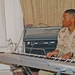 Spc. Jason Peoples accompanies the choir on the piano