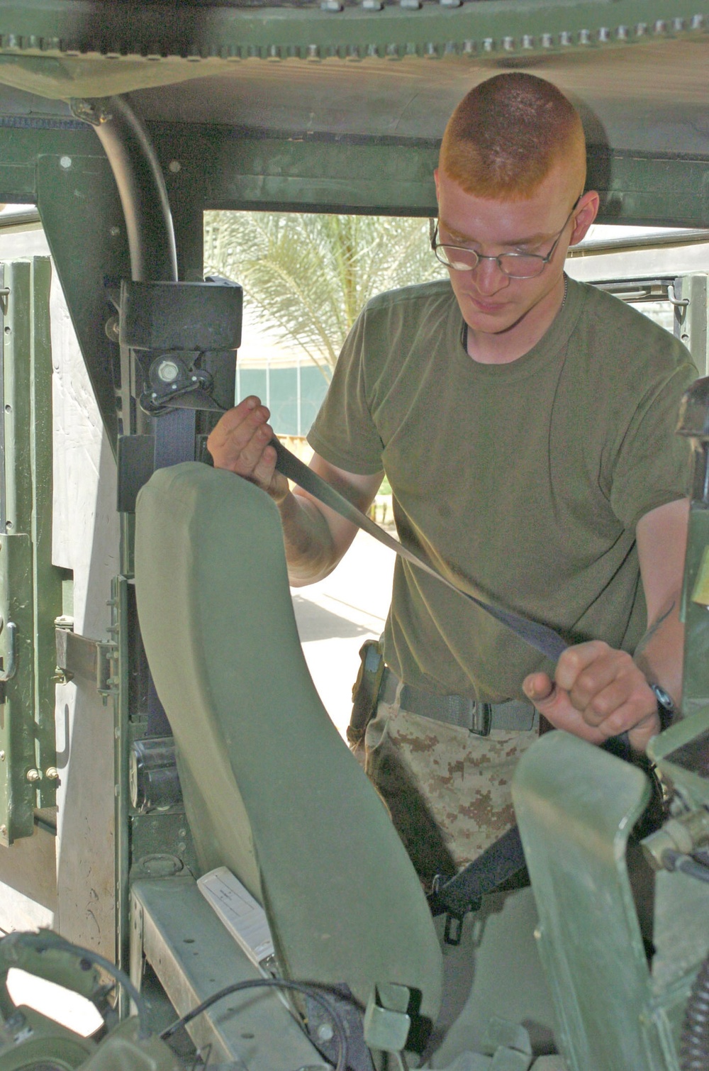 Cpl. Chris Pearo conducts a safety check of the safety belts
