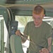 Cpl. Chris Pearo conducts a safety check of the safety belts