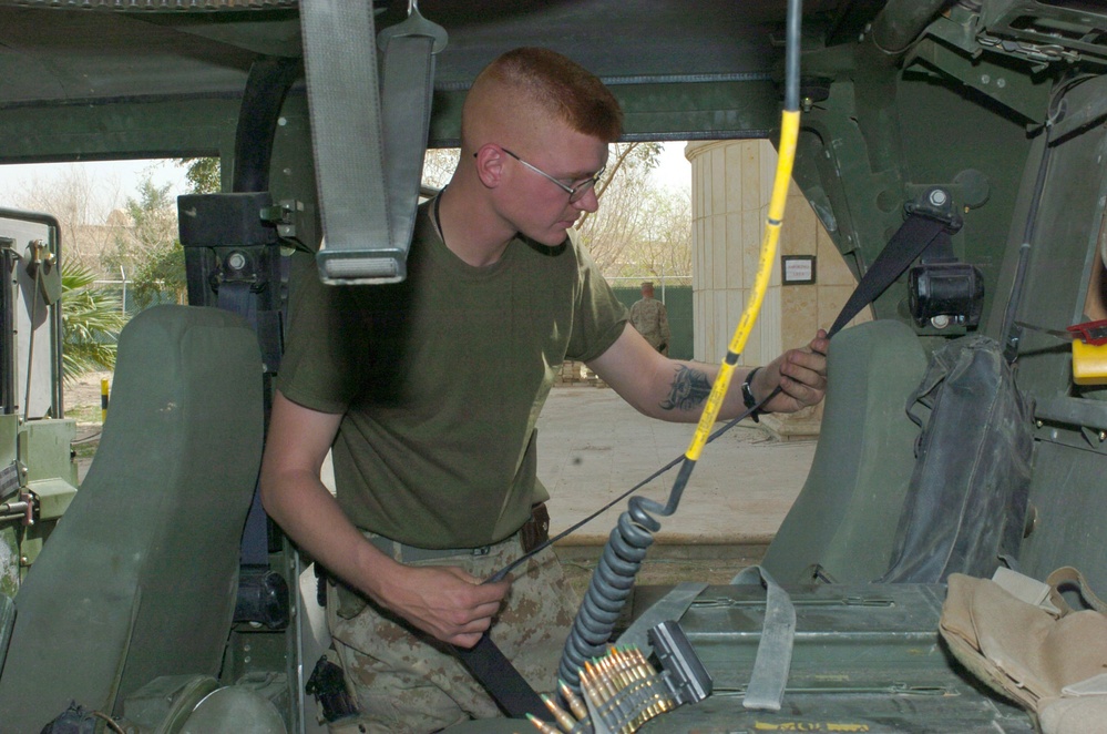 Cpl. Pearo conducts a safety check of the safety belts