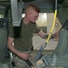 Cpl. Pearo conducts a safety check of the safety belts