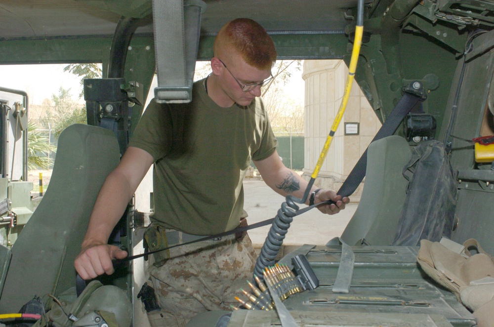Cpl. Pearo conducts a safety check of the safety belts