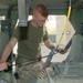 Cpl. Pearo conducts a safety check of the safety belts