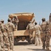 Iraqi National Guard soldiers load onto a truck