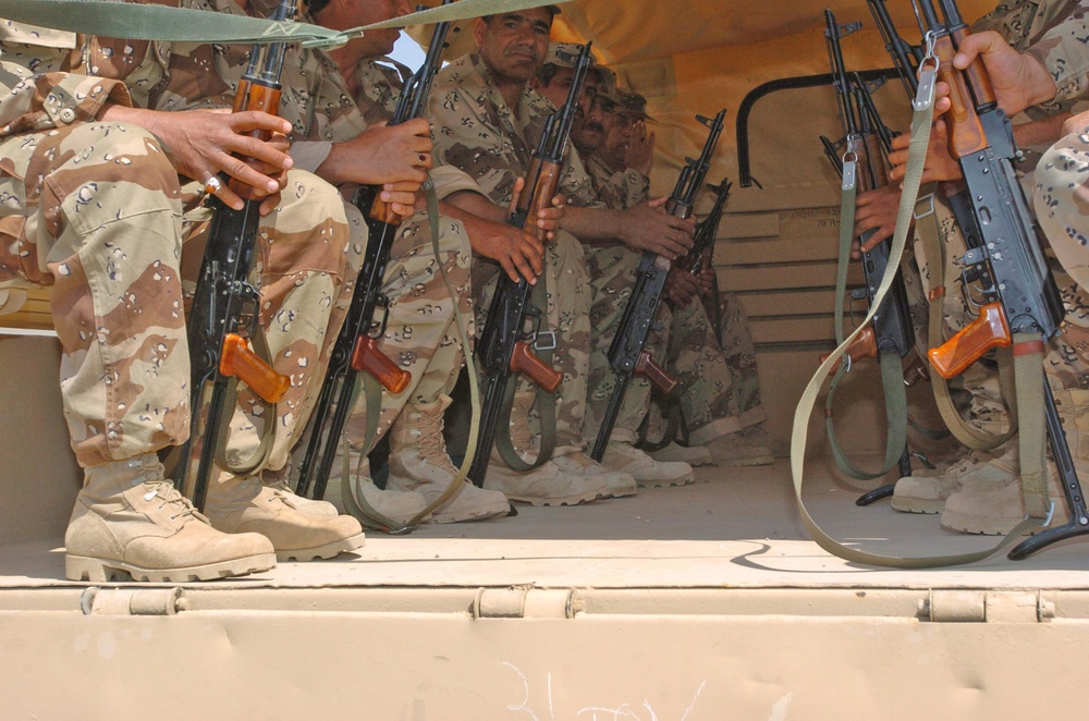 Iraqi National Guard soldiers loaded onto a truck