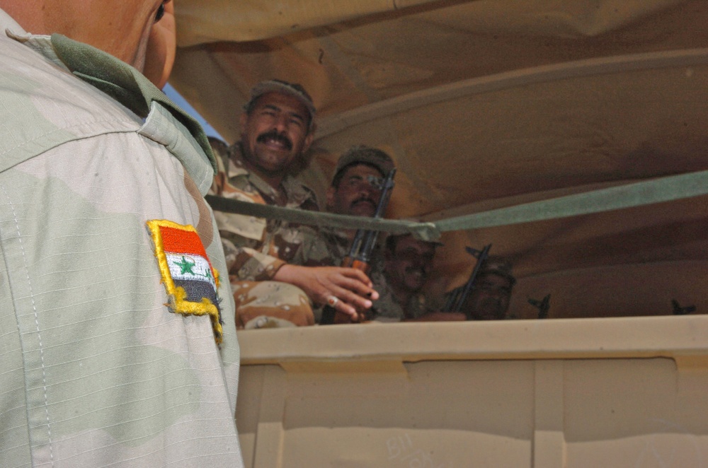 ING soldiers are loaded onto a truck during convoy training