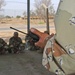 ING soldiers sit in the shade in a motor pool during a class