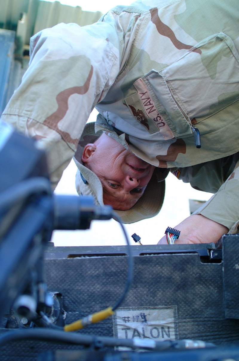 DVIDS - Images - PO 1st class Overton works to repair a Talon robot
