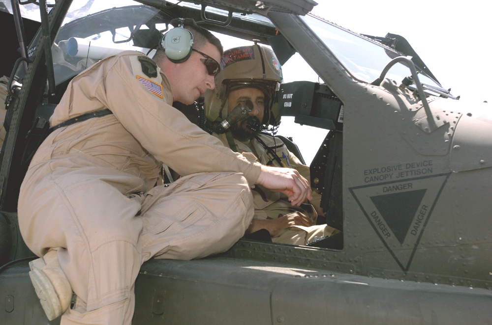 Capt. Whiting shows a Kuwaiti air force pilot the controls