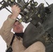 Capt. Beau Rollie inspects the tail rotor of his UH-64D