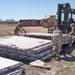 Soldiers work to consolidate about 120 pallets found