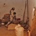 Spc. Jeremy Bosch searches a storage room