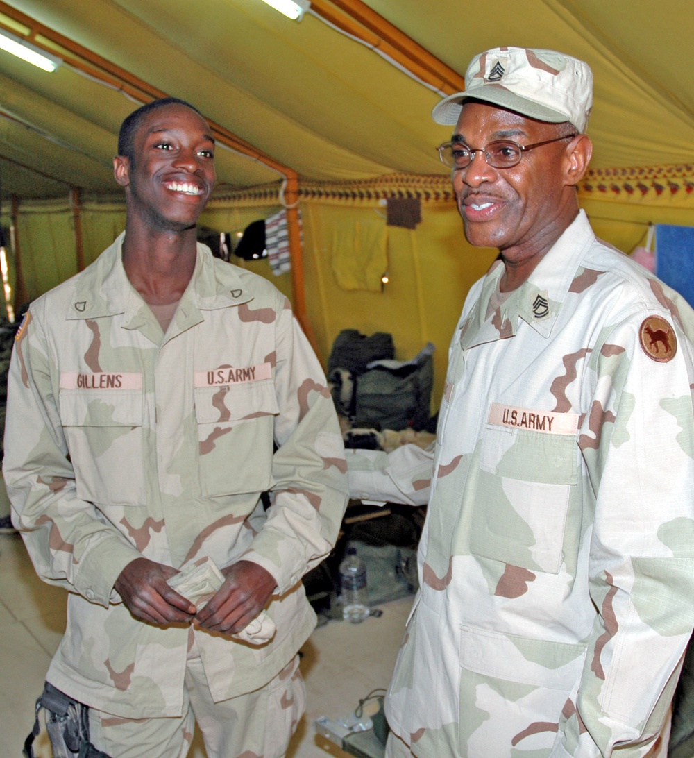 SFC Stanley Gillens shares a moment with his son