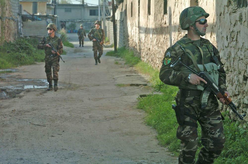 Albanian Soldiers conduct foot patrols