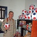 Col. Mason Thorna with the soccer balls his family sent