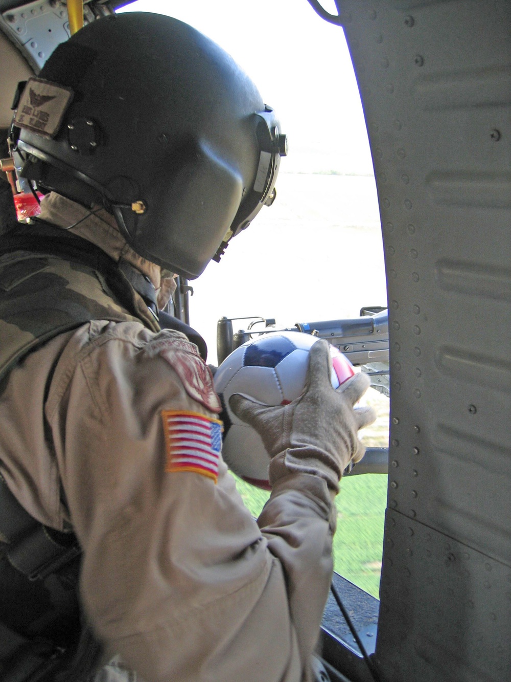 Spc. Dennis L. Virts prepares to drop a soccer ball