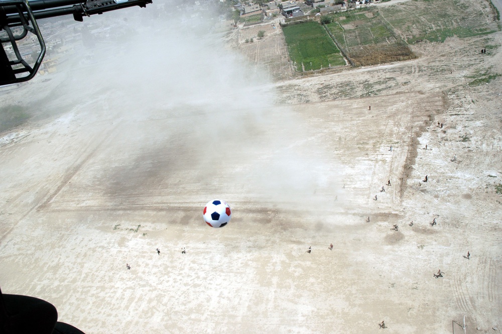 Soccer balls dropped from a UH-60 Black Hawk helicopter