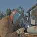 Sgt. Morris Steiner welds a bumper on a humvee