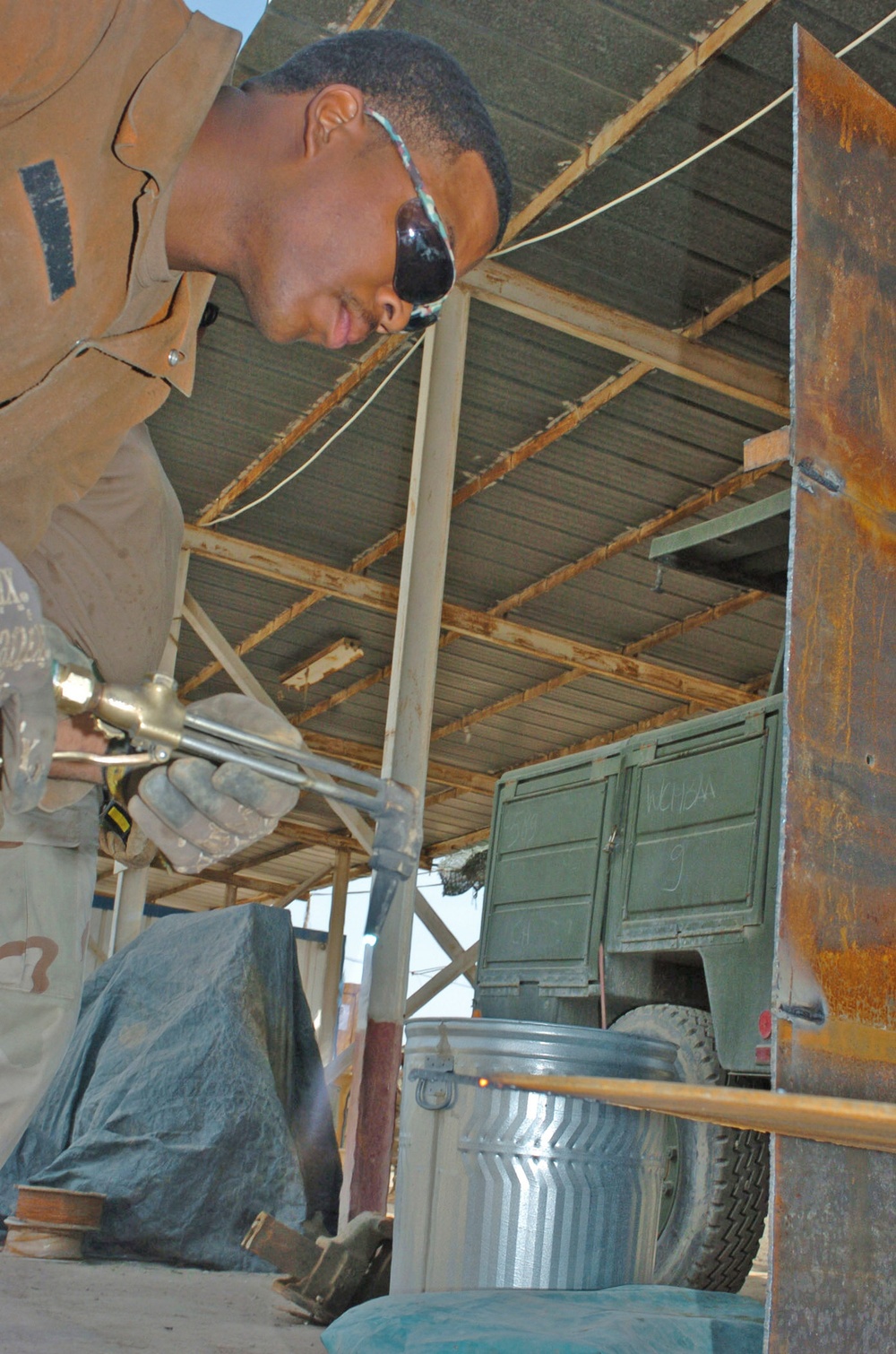 Spc. Ross preps his welding torch before he cuts