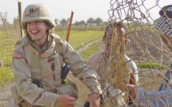 Capt. Knake de-worms a goat belonging to an Iraqi citizen