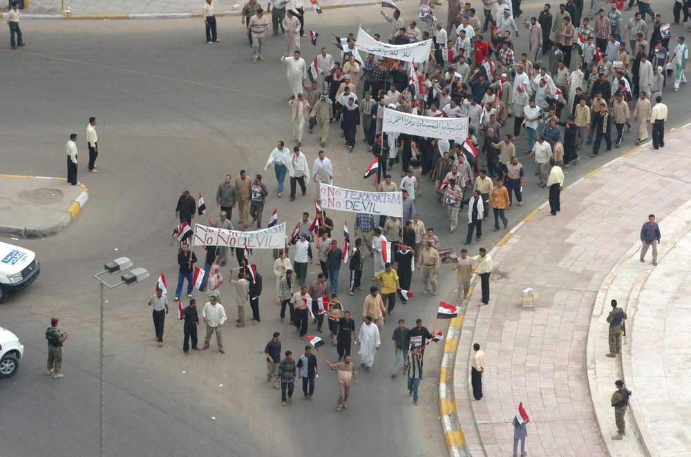 Protesters parade around the traffic circle