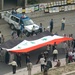 Iraqi Police maintain order as protesters parade around