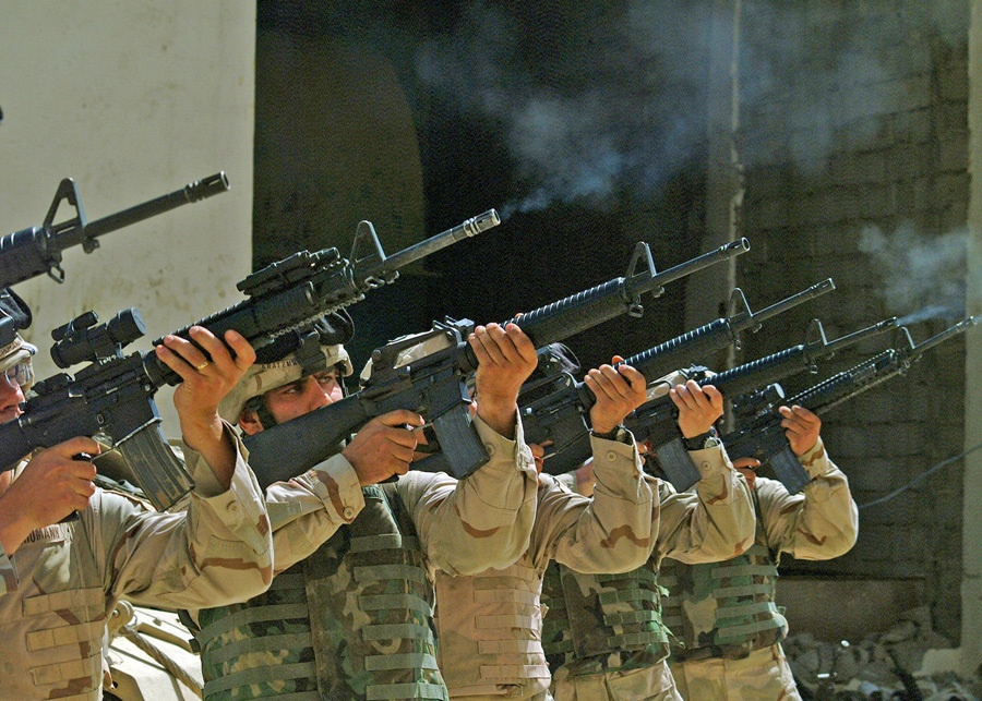An Honor Guard fires a 21 Gun salute