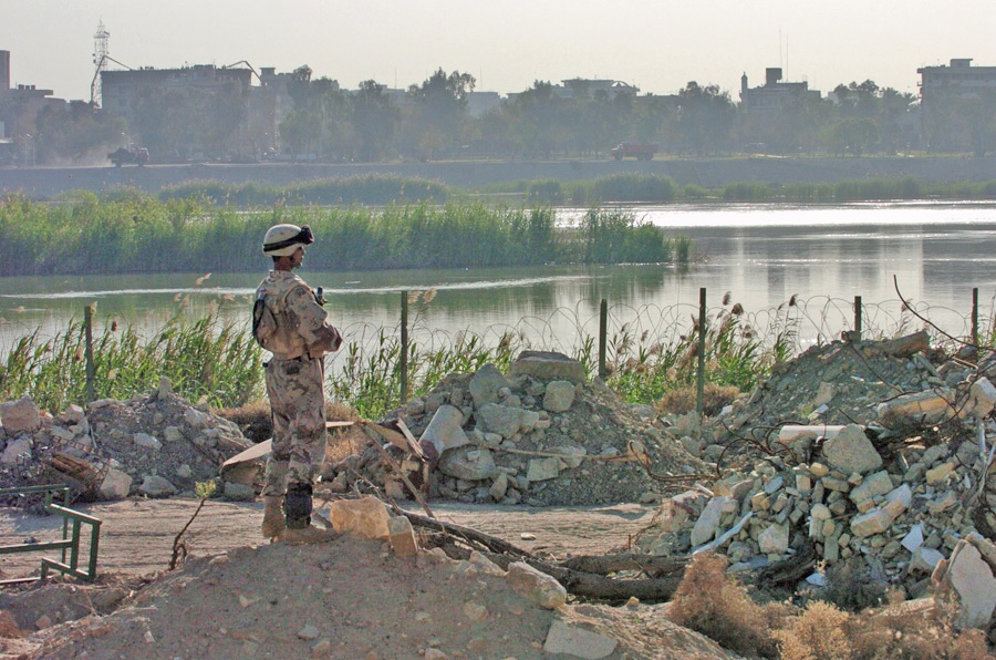 A Soldier looks out over the Tigris River toward Baghdad