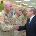 Donald Rumsfeld congratulates Staff Sgt. James Kirkpatrick