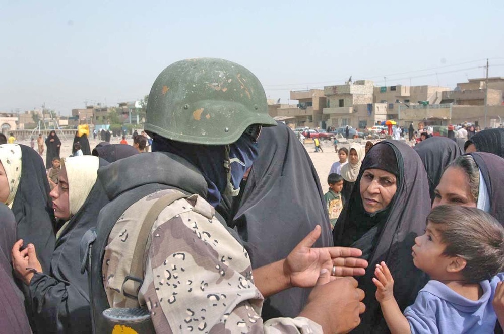 Iraqi Army Soldiers line up residents of Sadr City