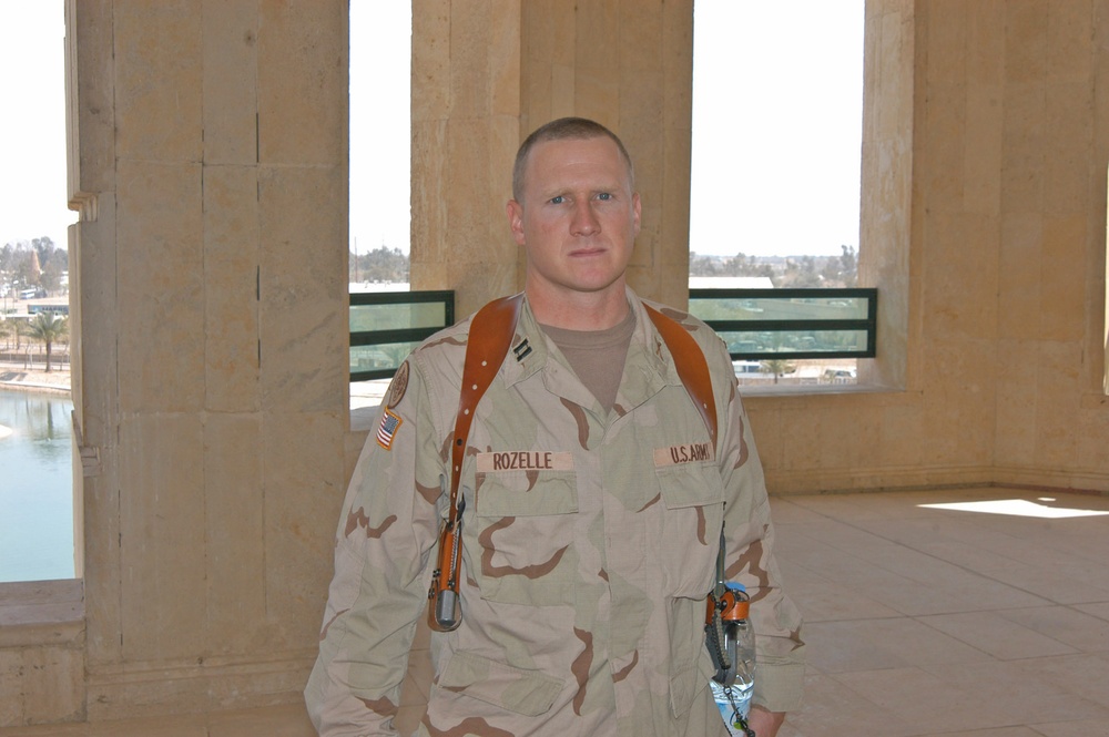 Cpt. David M. Rozelle stands on a third-floor balcony