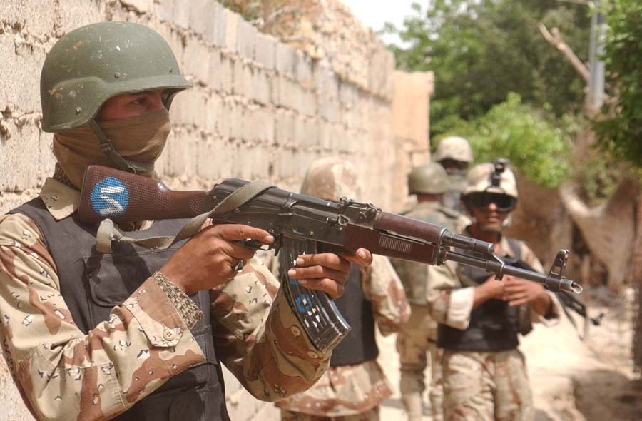 An Iraqi Army soldier pulls security during a patrol