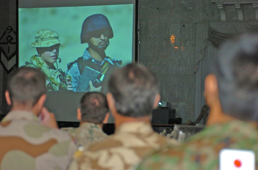 A Japanese Army officer watch a picture slide show