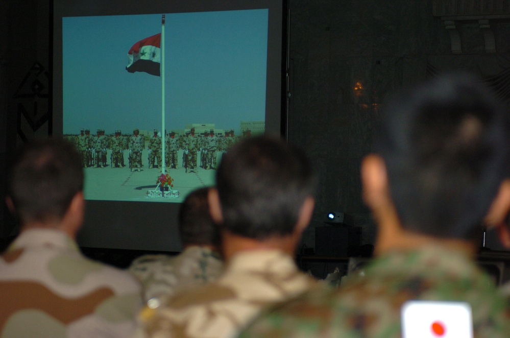 A Japanese Army officer watch a picture slide show