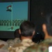 A Japanese Army officer watch a picture slide show