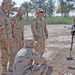 Sgt. Gates demonstrates sweeping techniques to Soldiers