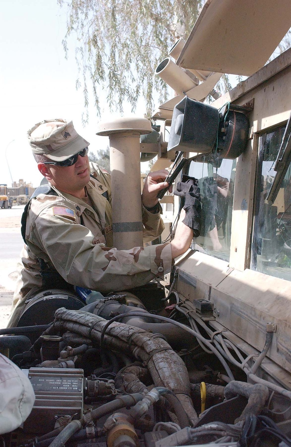 Sgt. James R. Baker cleans his windshield