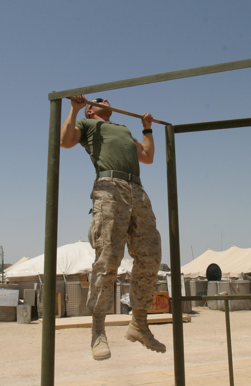 Lance Cpl. Jacob T. Barker does pull-ups