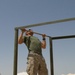 Lance Cpl. Jacob T. Barker does pull-ups