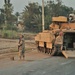 An Iraqi Army Soldier dismounts from a Bradley